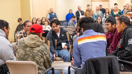 Members of the Saginaw Chippewa Indian Tribe perform a drumming ceremony at the Indigenous Peoples Day event.