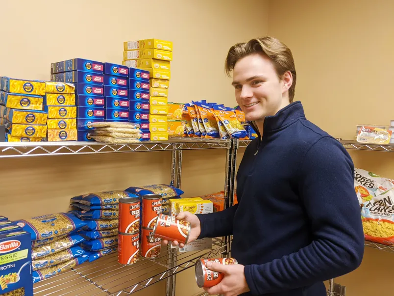 Mid students filling a Campus Cupboard Food Pantry order.