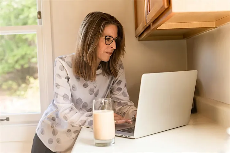 Woman typing on computer