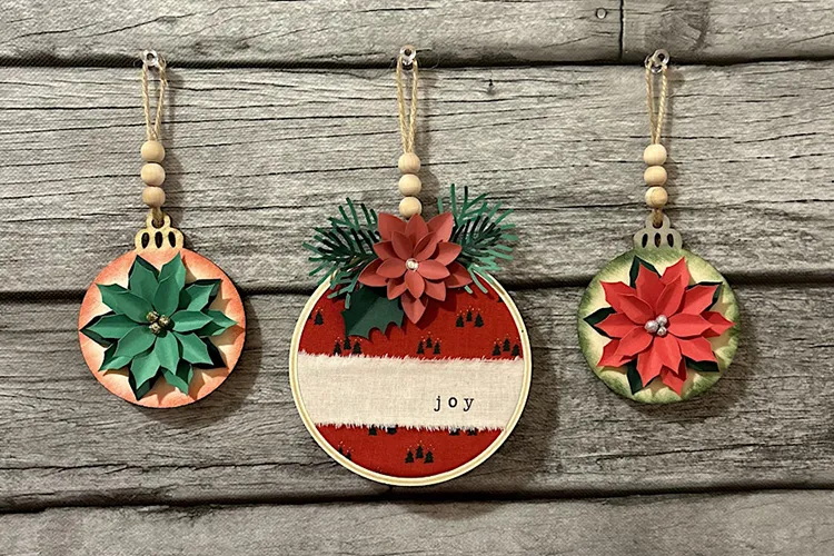 3 round Christmas ornaments resting on table