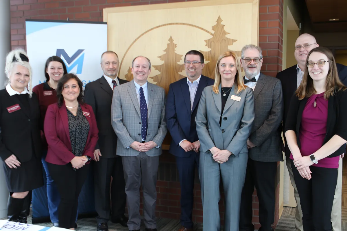 Group of college representatives gather to sign a new transfer agreement