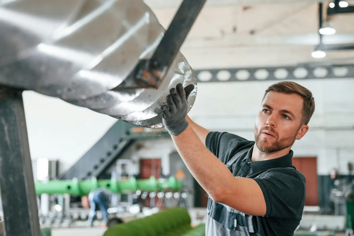 Man working in manufacturing facility.