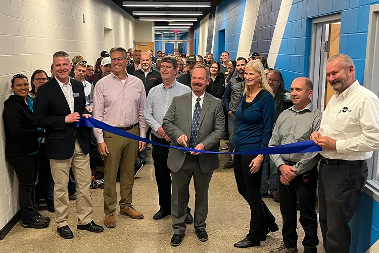 Mid employees at ribbon cutting event