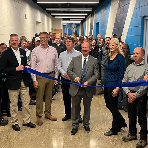 Mid employees at tech center ribbon cutting