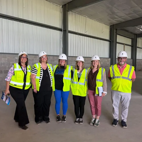 MACVB representatives meet with the Mid Foundation at the Event Center construction site.