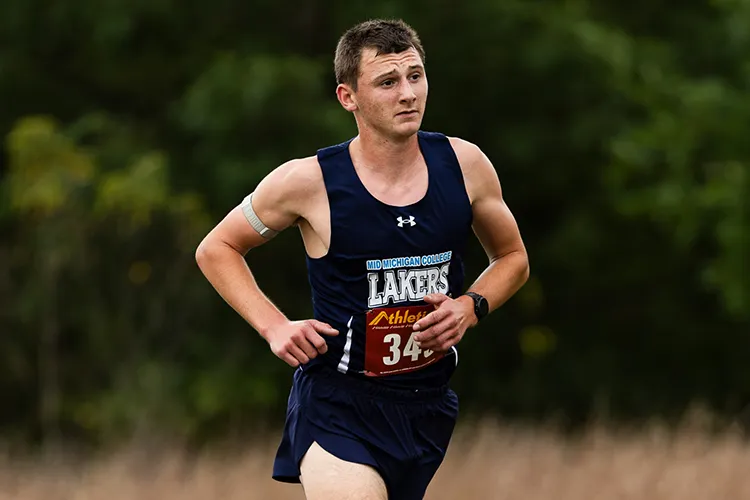 Drew Moore running a Cross Country Race