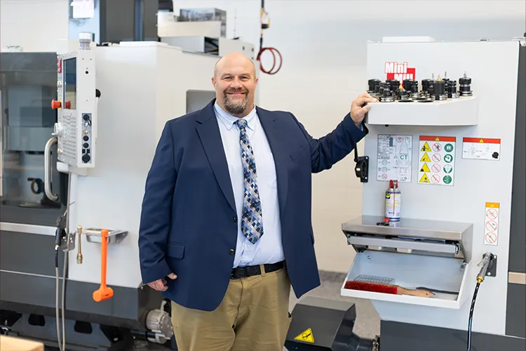 Student Shane Horton standing in the newly renovated AIM lab