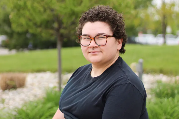 Mid Student Anna Drews Sitting Outside